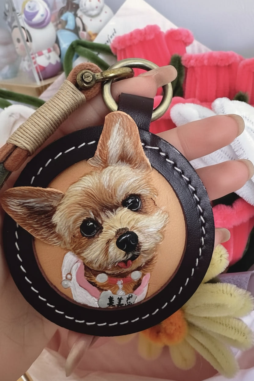 Round hand-painted leather portrait keychain featuring a small tan dog